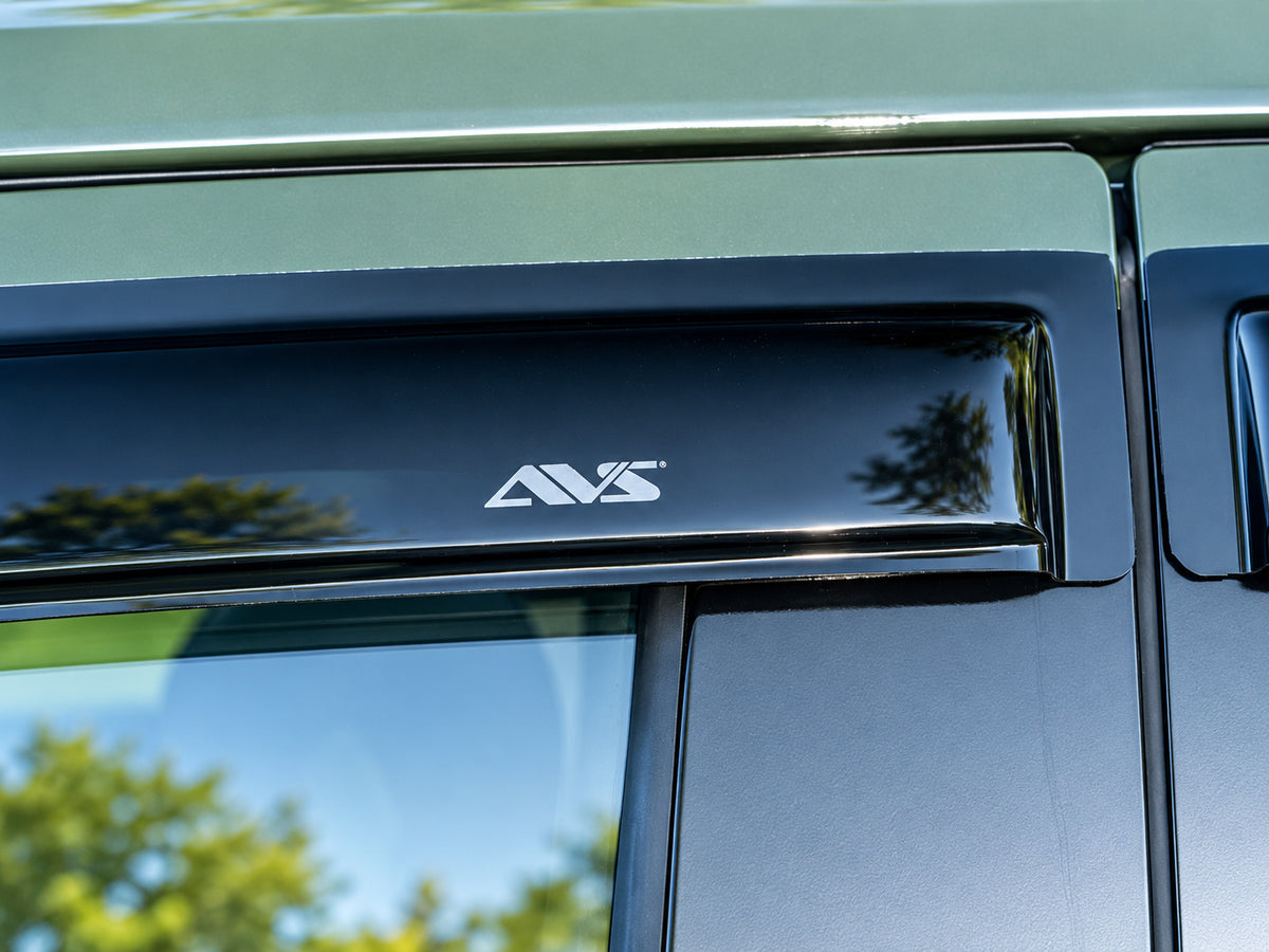 AVS dark-smoke outside-mount Ventvisor window deflectors for 2022–2026 Toyota Tundra CrewMax - Close Up Shot showing logo Front Visor