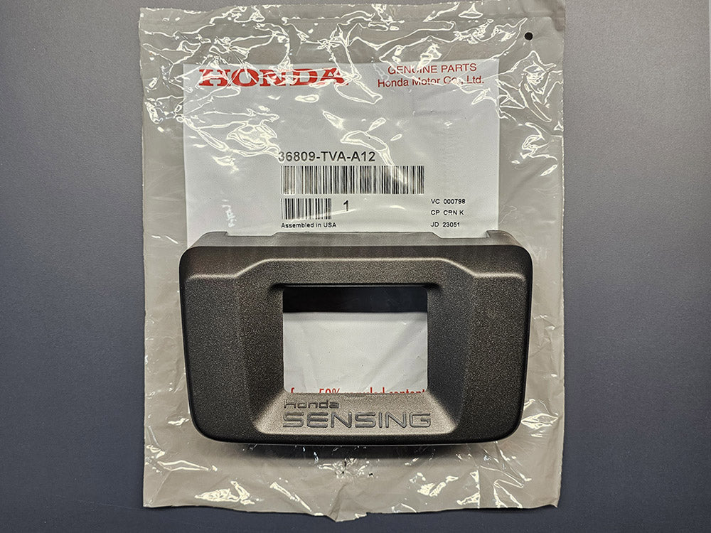 Genuine OEM Honda Sensing milliwave radar cover, part 36809-TVA-A12, shown on original Honda parts bag for 2018–2020 Accord models.