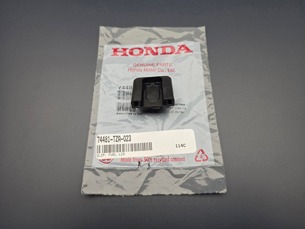 Genuine OEM Honda fuel lid clip 74481-TZA-023 with Honda packaging