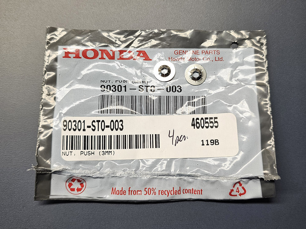 Close-up of Honda emblem stud fastener retainer washers