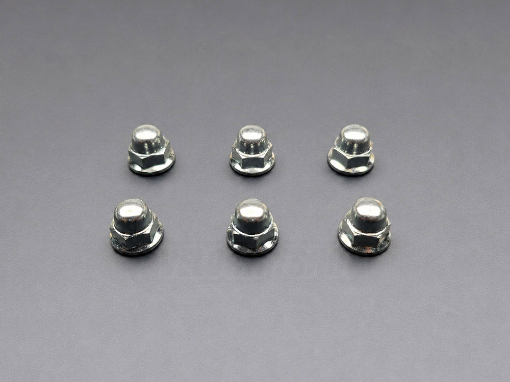 OEM Honda K-Series valve cover acorn nuts laid out as 6 piece replacement set