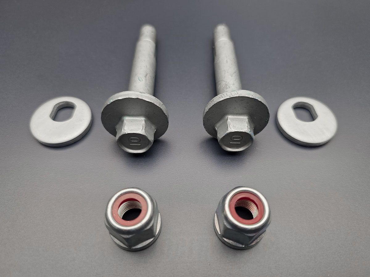 Close up of OEM Honda Acura rear alignment cam bolts washers and nuts for Accord TSX