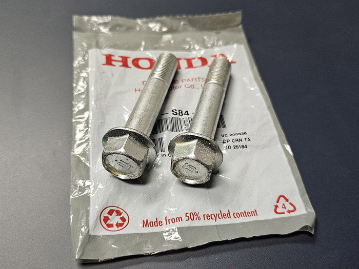 OEM Honda rear lower shock bolts for 2002–2006 Acura RSX – genuine factory hardware, 2-piece set on Honda packaging