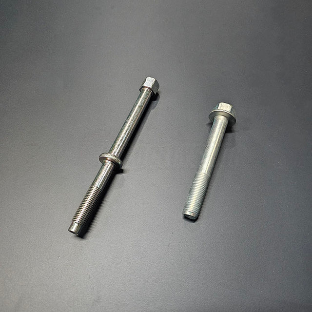 OEM Honda K-Series starter bolts 95701-12085-08 and 90027-PND-A00 side-by-side on dark background