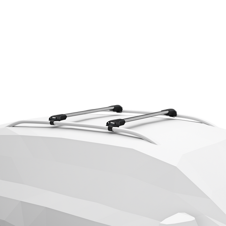 Two aluminum Thule WingBar Edge roof bars installed on vehicle roof rails