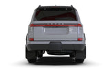 Rear view of Lexus GX 550 Luxury equipped with Rally Armor UR Mud Flaps – shows full coverage and black finish with silver logo