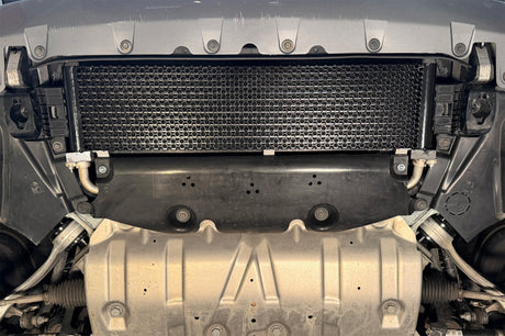 Installed CSF oil cooler mounted on BMW G20 M340i front crash bar area behind grille for improved engine oil temperature control