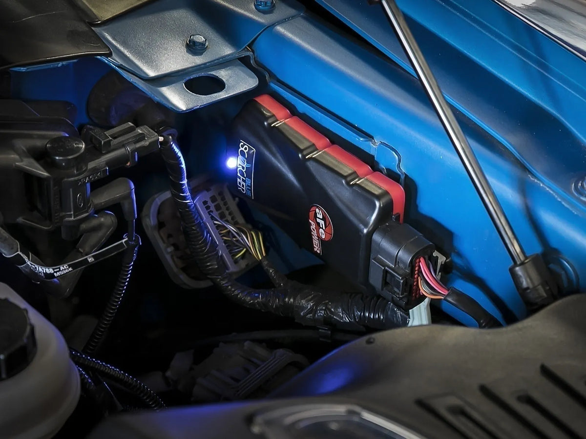 aFe SCORCHER BLUE Bluetooth power module for Toyota Tundra and Sequoia i-FORCE MAX hybrid - Installed in engine bay