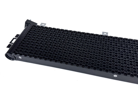 Rear core face of CSF BMW oil cooler showing high-density cooling fins and honeycomb protection mesh for improved heat dissipation