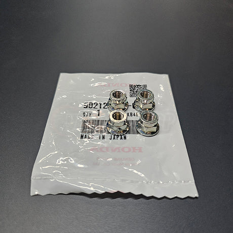 Genuine Honda B-Series VTEC valve cover Open End Nuts (under spark plug wire cover) close-up