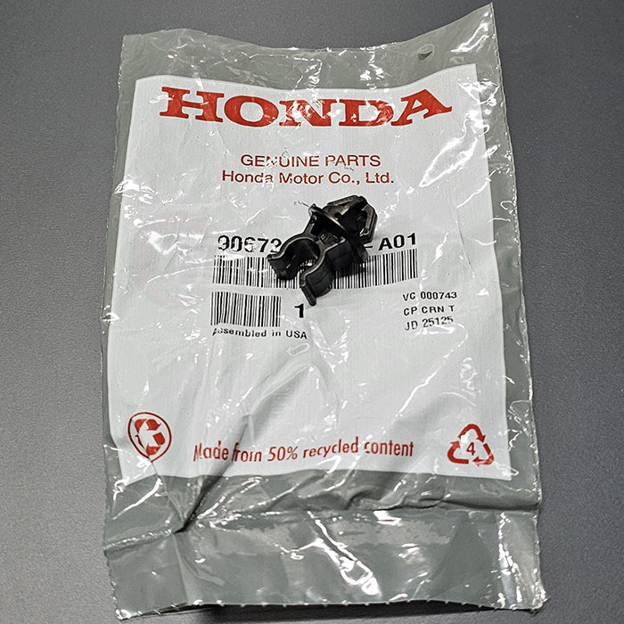 Close-up of Honda Civic hood stay clip installed in fender rail