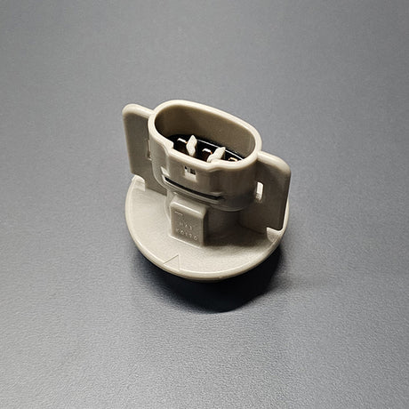 Close-up of genuine 94-01 Integra turn-signal socket or 02-05 Civic Si Reverse Light Socket showing contact pins