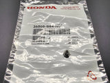 OEM Honda interior clock light bulb T3 neo-wedge with base shown on Honda packaging