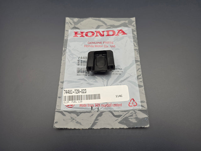 Genuine OEM Honda fuel lid clip 74481-TZA-023 with Honda packaging