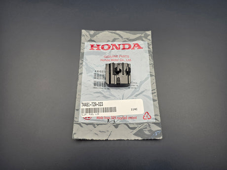 Honda fuel lid clip 74481-TZA-023 front view with OEM packaging