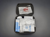 Honda First Aid Kit 08865-FAK-100 opened with basic first-aid supplies inside
