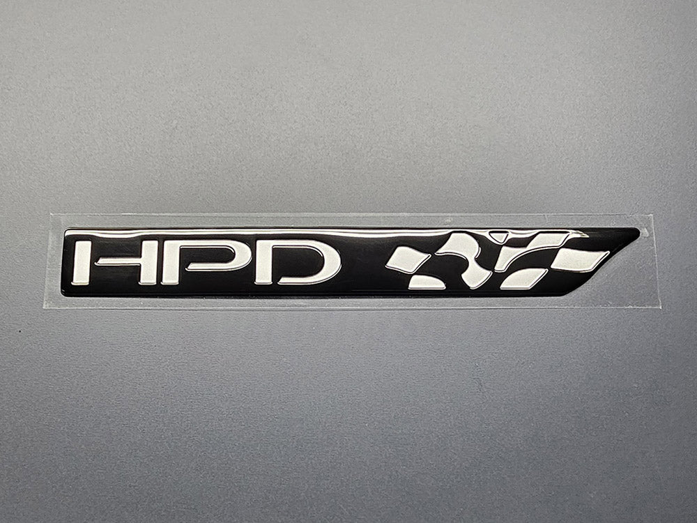 “OEM Honda Performance Development HPD emblem chrome badge for Honda vehicles.”