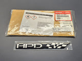 Authentic Honda HPD emblem displayed on official Honda packaging.