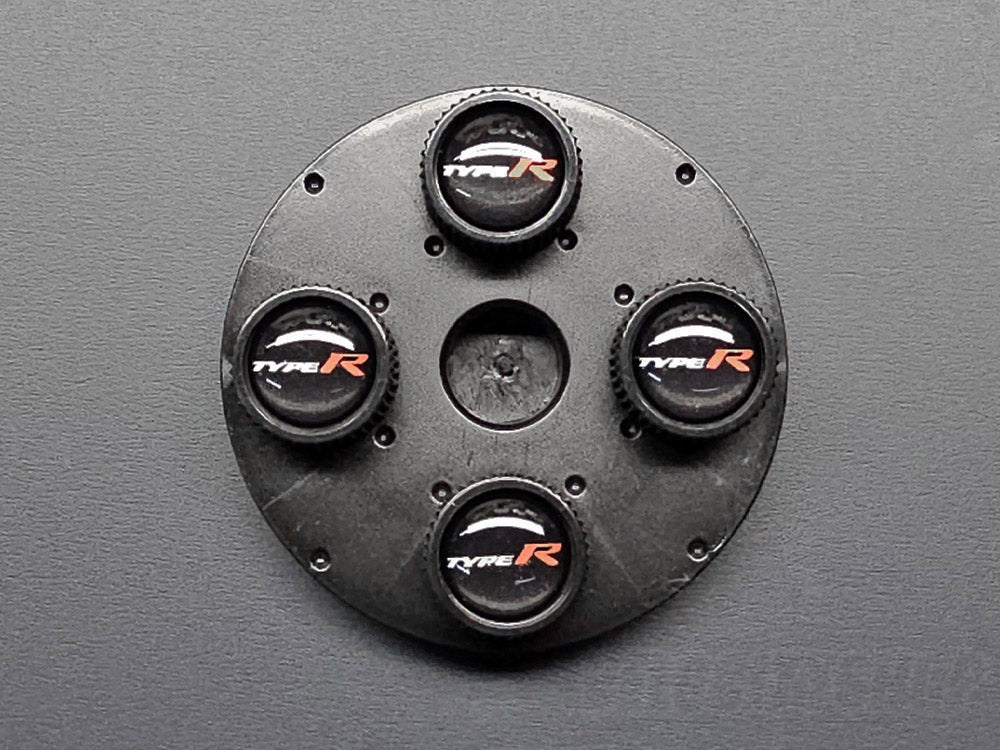 Honda Type R valve stem caps OEM accessory top-down view