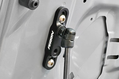 Black PERRIN high-lift hood brackets for 2015–2026 Subaru WRX and 2015–2021 STI installed view, hood side