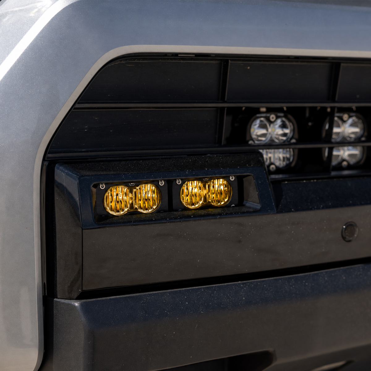 Baja Designs S2 Sport Baja Amber lights installed in the factory fog pocket of a 2025–2026 Toyota 4Runner