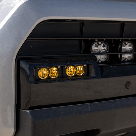 Baja Designs S2 Sport Baja Amber lights installed in the factory fog pocket of a 2025–2026 Toyota 4Runner