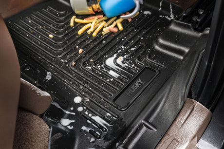 Husky WeatherBeater floor liners protecting Toyota Tacoma Hybrid from mud and spills
