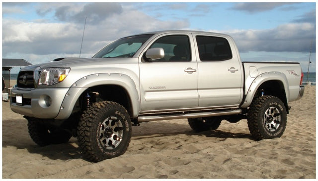 Husky matte-black Pocket Style fender flares for 2005–2011 Toyota Tacoma with 5-foot bed - installed on Silver Color Truck