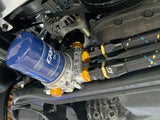 GReddy -10AN 90-degree swivel hose end in black and gold anodized aluminum