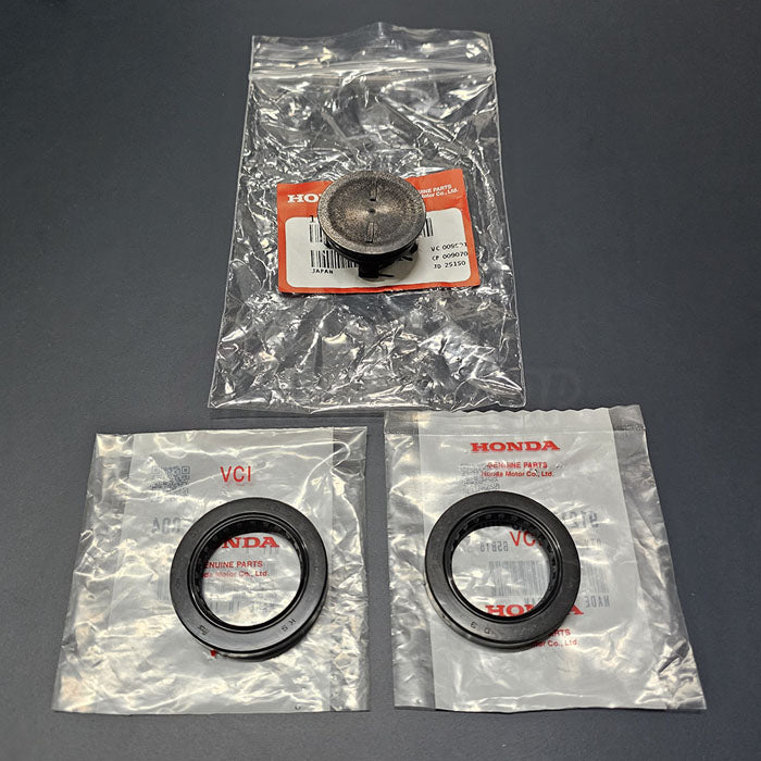 Genuine Honda 91213-PR3-004 seals & 12513-P72-003 cam plug shown in original packaging