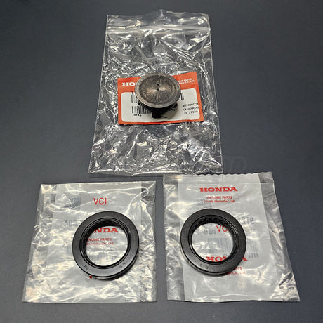 Genuine Honda 91213-PR3-004 seals & 12513-P72-003 cam plug shown in original packaging