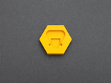 Top view of yellow PETG battery terminal cover for Milwaukee M12 batteries