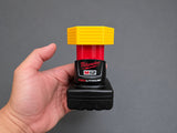 Front view of yellow PETG terminal cover fitted over a Milwaukee M12 battery stem